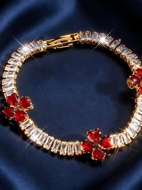 Elegant Gold Bracelet with Red Clover Crystal Accents